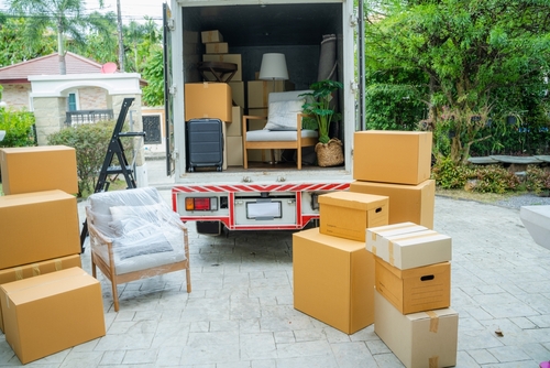 A clean, professional Paul's Moving and Labour Service truck parked on a quiet Surrey residential street.
