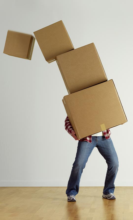 man with too many moving boxes